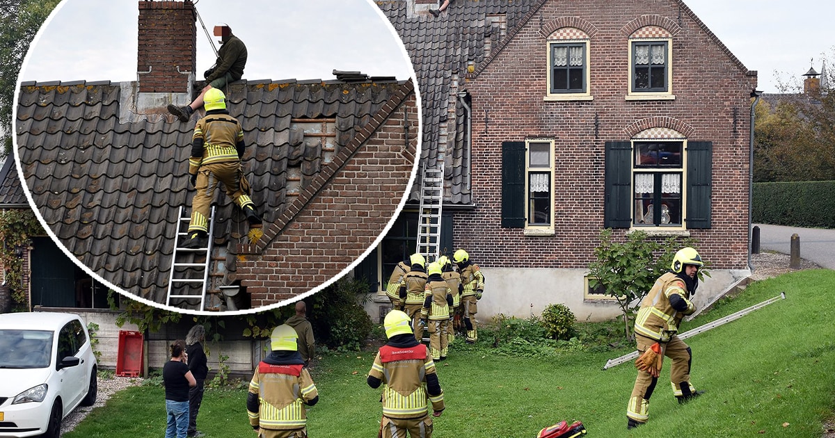 Man zit vast op metershoog dak in Zuilichem, brandweer zet hoogwerker in om hem te redden