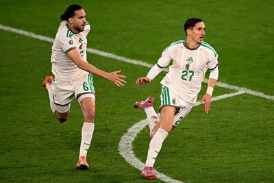 https://images.bd.nl/Yjg2NjE5OGVlOWE1Yjg1M2EwMTIvZGlvLzI2ODMxODEwNy9maXQtd2lkdGgvNDAw/algeria-s-midfielder-6-ramiz-zerrouki-and-algeria-s-forward-27-adil-boulbina-celebrate-after-the-africa-cup-of-nations-can-round-of-16-football-match-between-algeria-and-democratic-republic-of-congo-at-the-prince-moulay-el-hassan-stadium-in-rabat-on-january-6-2026-photo-by-sebastien-bozon-afp